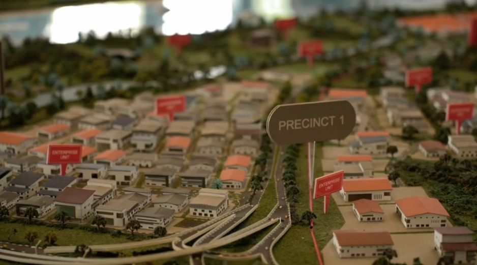 Exclusive Preview Aluna Residences — sales gallery overview with scale model